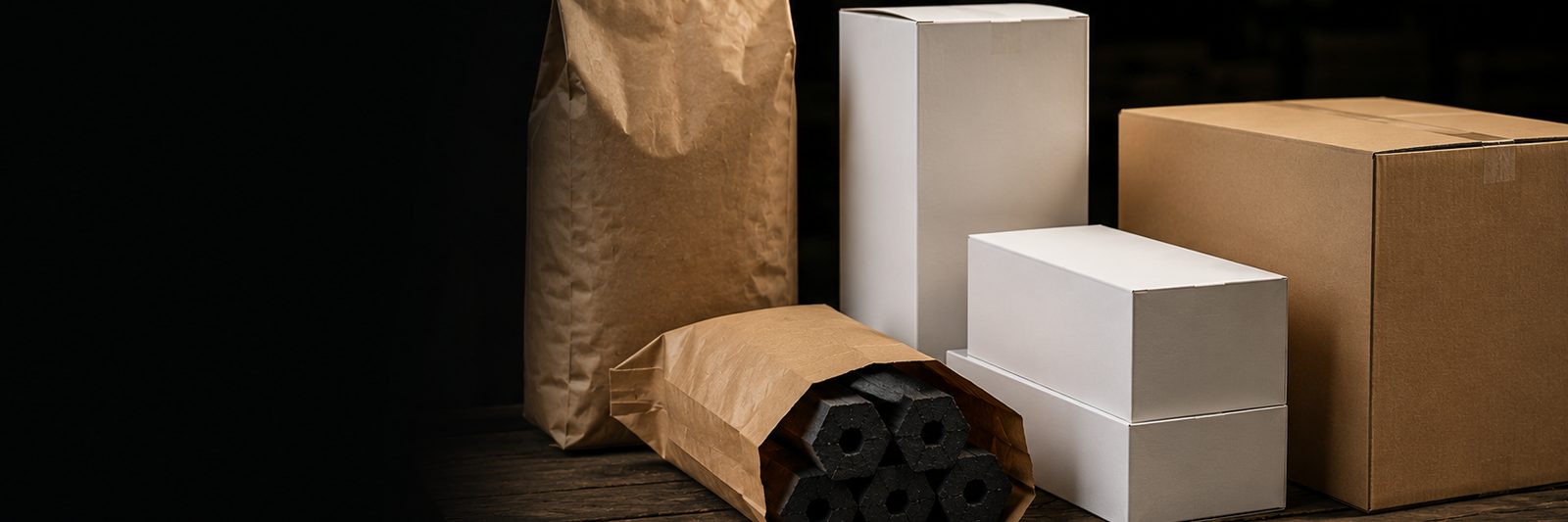 Blank kraft bags, color boxes and export cartons beside machine-made charcoal sticks