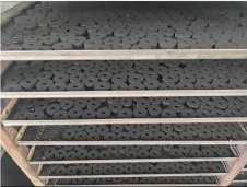 Ring-shaped charcoal drying on factory racks