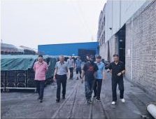 Visitors touring the factory yard
